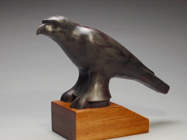 "Falcon". Ceramic, wood base. 15" x 6" x 12.5" ©Julia Mulligan