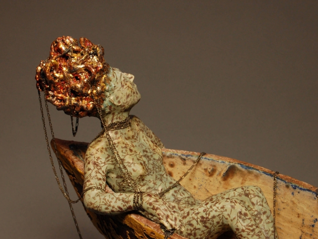 Detail, "Adrift". Ceramic, chain, gold leaf, iron base. 11 x 4.5 x 11.5 inches.  ©Julia Mulligan