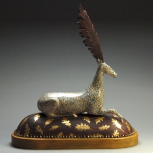 "Resting Deer". Ceramic, gold leaf, silver beads, brass, iron, wood base. 18 x 7 x 19 inches. Hand Built. Sold.