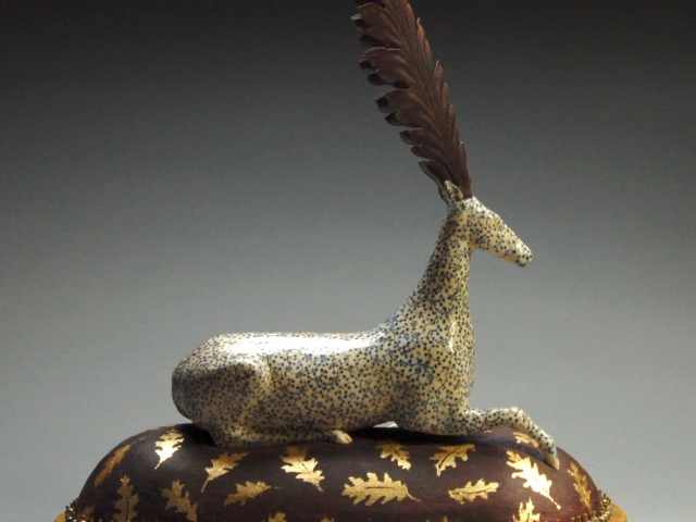 "Resting Deer". Ceramic, gold leaf, silver beads, brass, iron, wood base. 18 x 7 x 19 inches. (Sold)