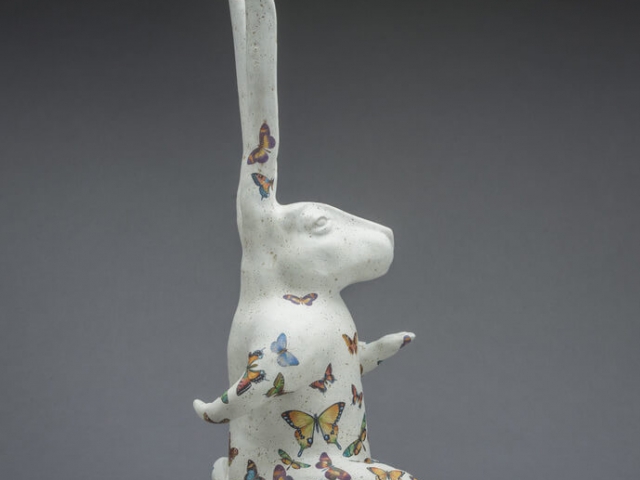 "White Rabbit Apocalypse". Ceramic, glaze, oil, wood base. 30.5 x 9 x 14 inches.