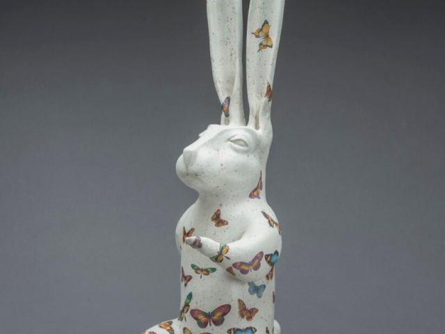 "White Rabbit Apocalypse". Ceramic, glaze, oil, wood base. 30.5 x 9 x 14 inches.