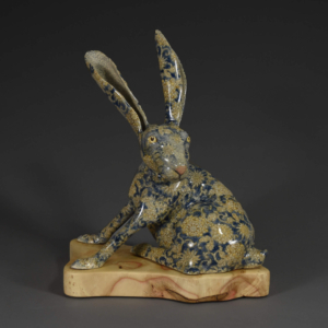 "Rabbit Run"  Ceramic, Boxelder Wood Base. 11" x 6.5" x 12" Hand built. &copy;Julia Mulligan. Sold.
