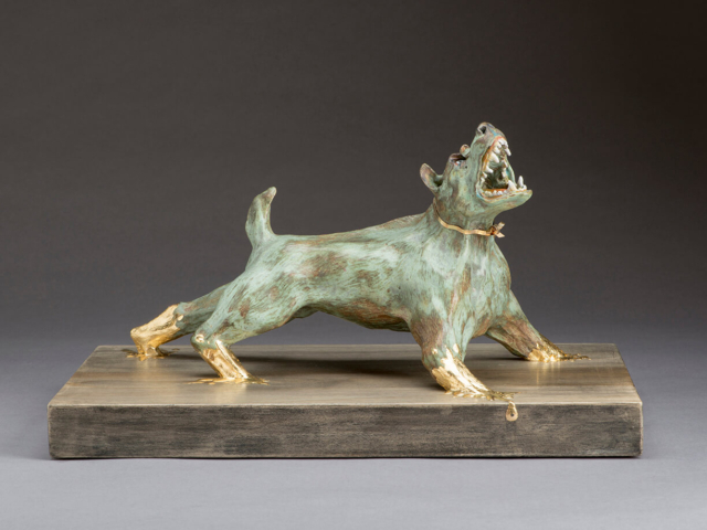 "My Pet Dogma" 12 x 8 x 7 in. Ceramic, gold leaf, wood base, gold wire. ©Julia Mulligan