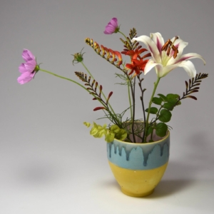 Yellow, blue and pink vase.  Porcelain, glaze, gold luster.