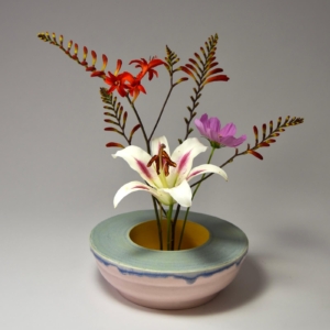 Double Walled, pink, blue green and yellow low vase. Porcelain, glaze.